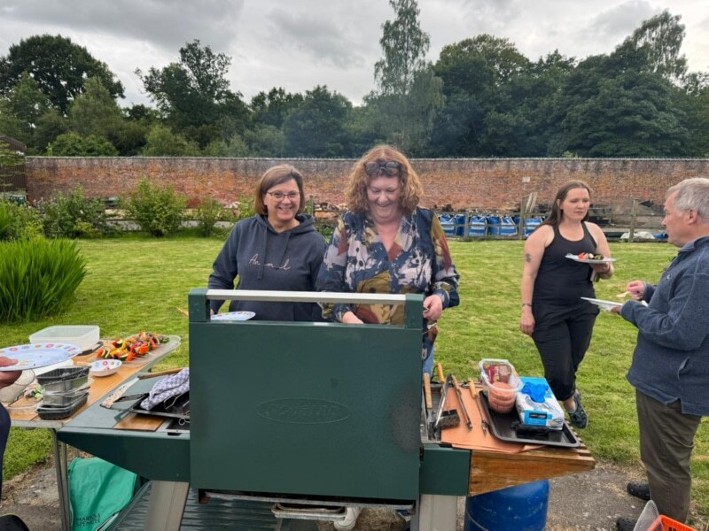Fran at the grill with Jenifer, Jackie and Bob