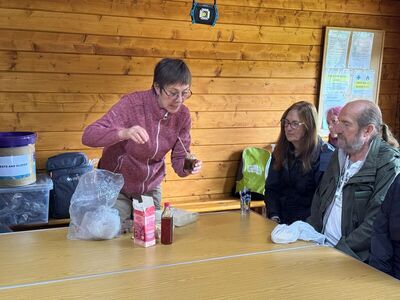 Anna demonstrating products made from foraged ingredients