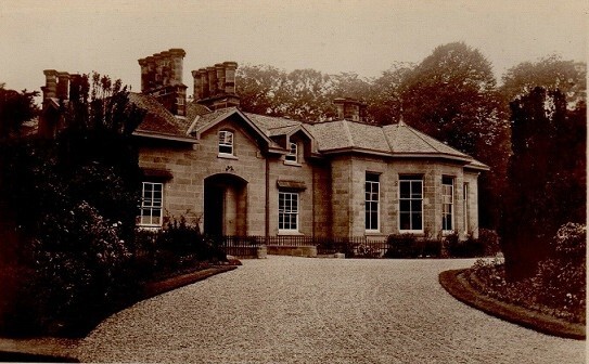 B&W picture of front entrance and driveway to William Simpson Asylum